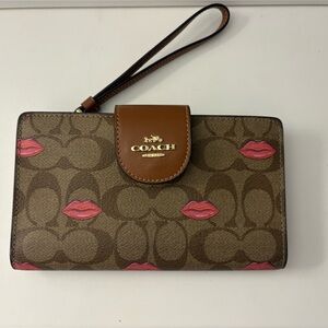 COACH Brown Signature Tech Wristlet with Pink Lip Accents